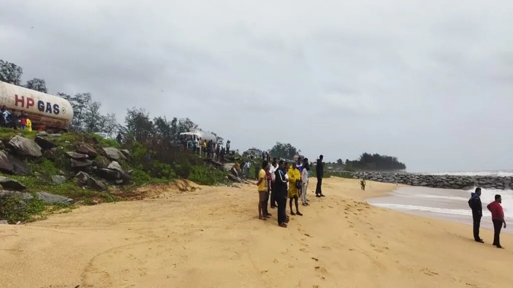 kundapura Young man splashes water at Maravante beach